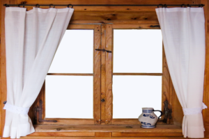 use curtains to make small windows look bigger